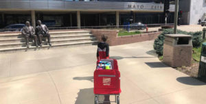 Child pulling Wagon in front of Mayo Clinic