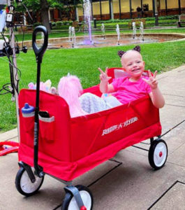 Child smiling in Wagon