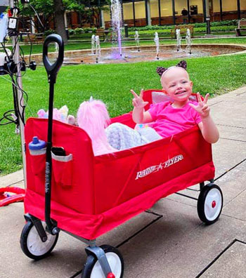 Child smiling in Wagon