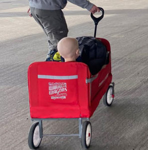 Child being pulled in Warrior Wagon