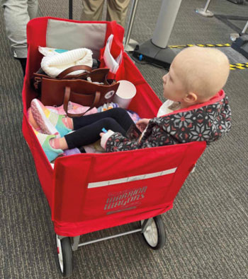 Ellie, age 4, riding in Warrior Wagon