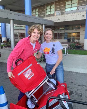 Warrior Wagon volunteers standing outside the hospital